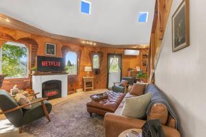 a living room with a couch and a fireplace at 9 Minute Drive to the Lake in Chelan