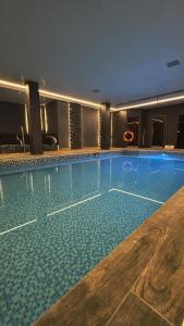 a large swimming pool in a hotel at Stonecross Manor Hotel in Kendal