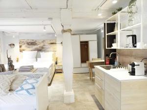 a room with two beds and a kitchen with a sink at NOX HOTEL - Digital-Check-In - No Reception - nahe Bretten & Karlsruhe - 6 Beach in Wössingen
