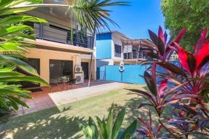a view of a house from the garden at Huge Stylish Townhouse in Stuart Park