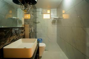 a bathroom with a sink and a toilet at Shree Goljyu Palace in Almora +18 photos