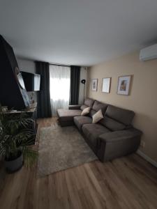 a living room with a couch and a rug at Sitges Casablanca in Sant Pere de Ribes