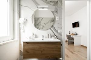 a bathroom with a sink and a mirror at Dimora dei Cedri in Santa Maria del Cedro +22 photos