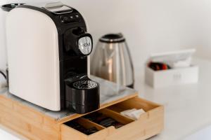 a coffee maker sitting on top of a counter at Dimora dei Cedri in Santa Maria del Cedro