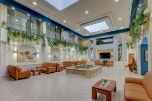 a hospital lobby with couches and a table at Hotel Shipka All Inclusive in Golden Sands