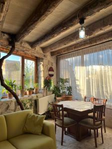 a living room with a table and a couch at Sevin Stone Hotel in Göreme