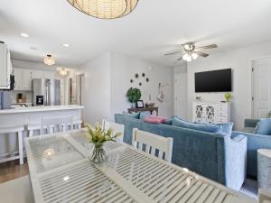 a living room with a couch and a table at Beachside Villas #821 - Dreamweaver in Seagrove Beach +35 photos