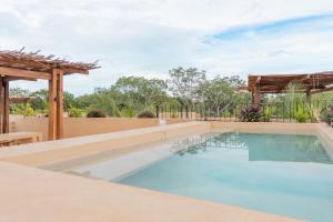 a swimming pool in a house at Luxury Penthouse, Rooftop Pool and Lagoon in Bacalar