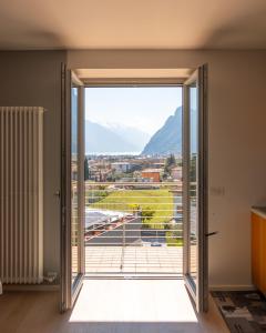 an open door to a balcony with a view at View & Chill Apartment in Riva del Garda