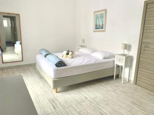 a bedroom with a bed and a mirror in it at Hayeks Villa private pool near the beach in Daratso