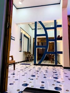 a room with a door with a tile floor at Dream Mahal in Kattankudi