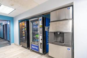two vending machines in a room with drinks at Days Inn by Wyndham Sioux City in Sioux City