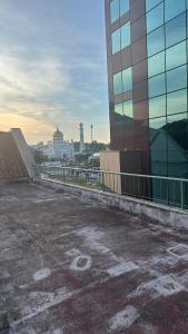 an empty parking lot in front of a building at First Avenue Male Hostel BSB in Bandar Seri Begawan +13 photos