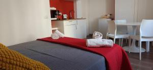 a bedroom with a bed and a table and chairs at Appartamenti Mergellina in Naples