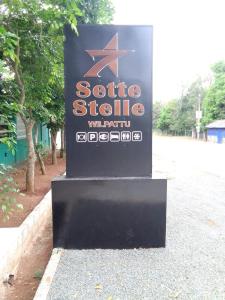 a sign for a movie studio which is on a street at Sette Stelle in Pahala Maragahawewa