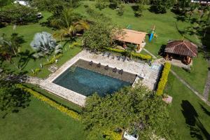 an overhead view of a swimming pool in a yard at Ecohotel La Italia- Hotel Venecia, Antioquia in Venecia