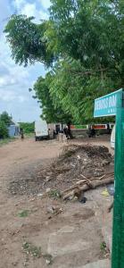 a street sign in front of a dirt road at DeBoss Arena in Abeokuta