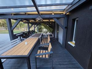 a row of benches on the deck of a building at White in Biała +38 photos