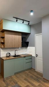 a kitchen with a sink and a counter top at Sunset Telavi in Telavi