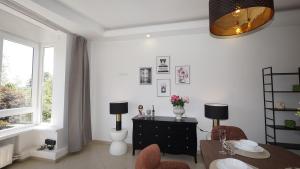 a living room with a table and chairs and a window at Rubens Loft four bedrooms two bathrooms in Antwerp +53 photos
