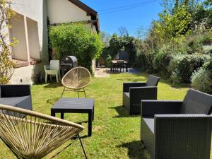 a group of chairs and tables in a yard at Le Clos Verdonnais in Verdon