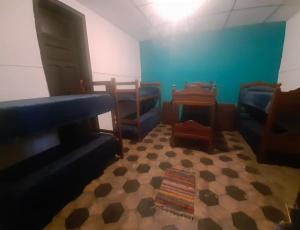 a room with chairs and a couch and a table at 7 duendes in Salta