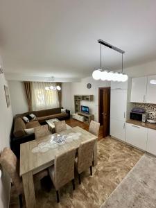 a living room with a table and a couch at White Hill in Ulcinj