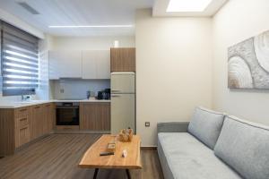 a living room with a couch and a table at Antaia 4 in Nafplio