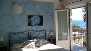 Postel nebo postele na pokoji v ubytování B&B Il Feriolo