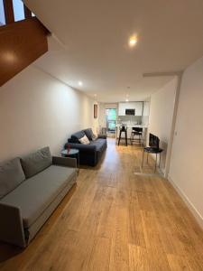 a living room with a couch and a table at Marne appartements in Nogent-sur-Marne +45 photos