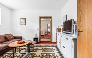 a living room with a couch and a tv at Appartement in de buurt van winterberg in Winterberg