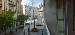 a view of a city street with a statue at Ira's Square 2 Bedroom Free Parking in Skopje