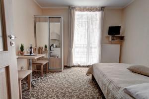Posteľ alebo postele v izbe v ubytovaní Apartamenty Parkowa