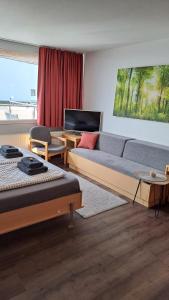 a living room with two beds and a couch at Himmelsleiter in Sankt Englmar