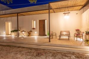 a large patio with a table and chairs at Villa Fefè in Nardò +33 photos