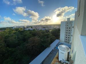 a view of a city from the balcony of a building at Conforto e praticidade perto do aeroporto in Aracaju