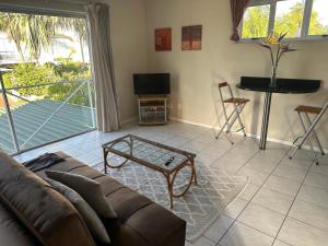 a living room with a couch and a table at Loft Style Apartment in Monte Vista