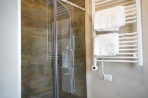 a shower stall in a bathroom with towels at Silia's Place rooms & breakfast in Ripi +34 photos