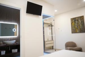 a bathroom with a sink and a mirror at Silia's Place rooms & breakfast in Ripi