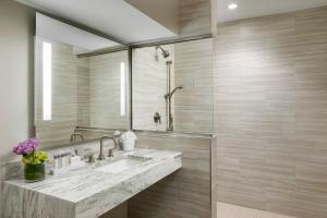 a bathroom with a sink and a mirror at Boston Park Plaza in Boston