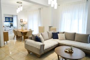 a living room with a couch and a table at Lagoon Dream in Fanari