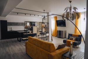 a living room with a couch and a living room with a table at Portico Provenzali in Cento