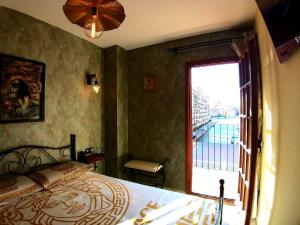a bedroom with a bed and a large window at Premium Oceanside Apartment, Pool, Parking in Port Saplaya +117 photos