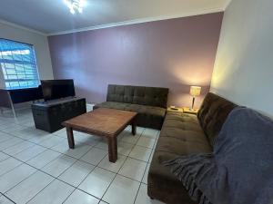 a living room with a couch and a coffee table at Gorgeous Holiday Home in Monte Vista