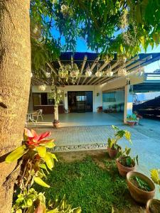 a view of a house with a courtyard with plants at Evergreen Private Pool Villa - Cavite in General Trias