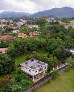 an aerial view of a house in a city at Brisa del Rio Jimenoa in Jarabacoa