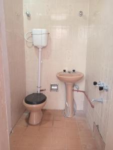 a bathroom with a toilet and a sink at SB hostel in La Rioja
