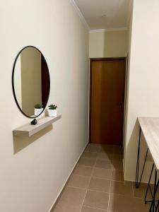 a hallway with a mirror and a door at Chill Home VIII in Posadas