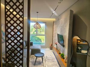 a living room with a table and a window at 60 seconds walk to the Beach in Golem