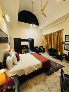 a bedroom with a large bed in a room at The Regalis Villa in Lucknow